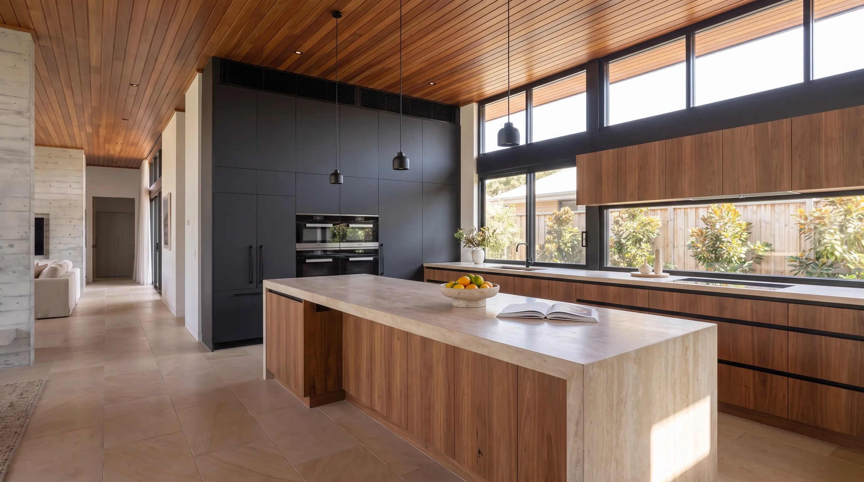 Interior study: kitchen with limestone waterfall island, spotted-gum joinery and black pendants