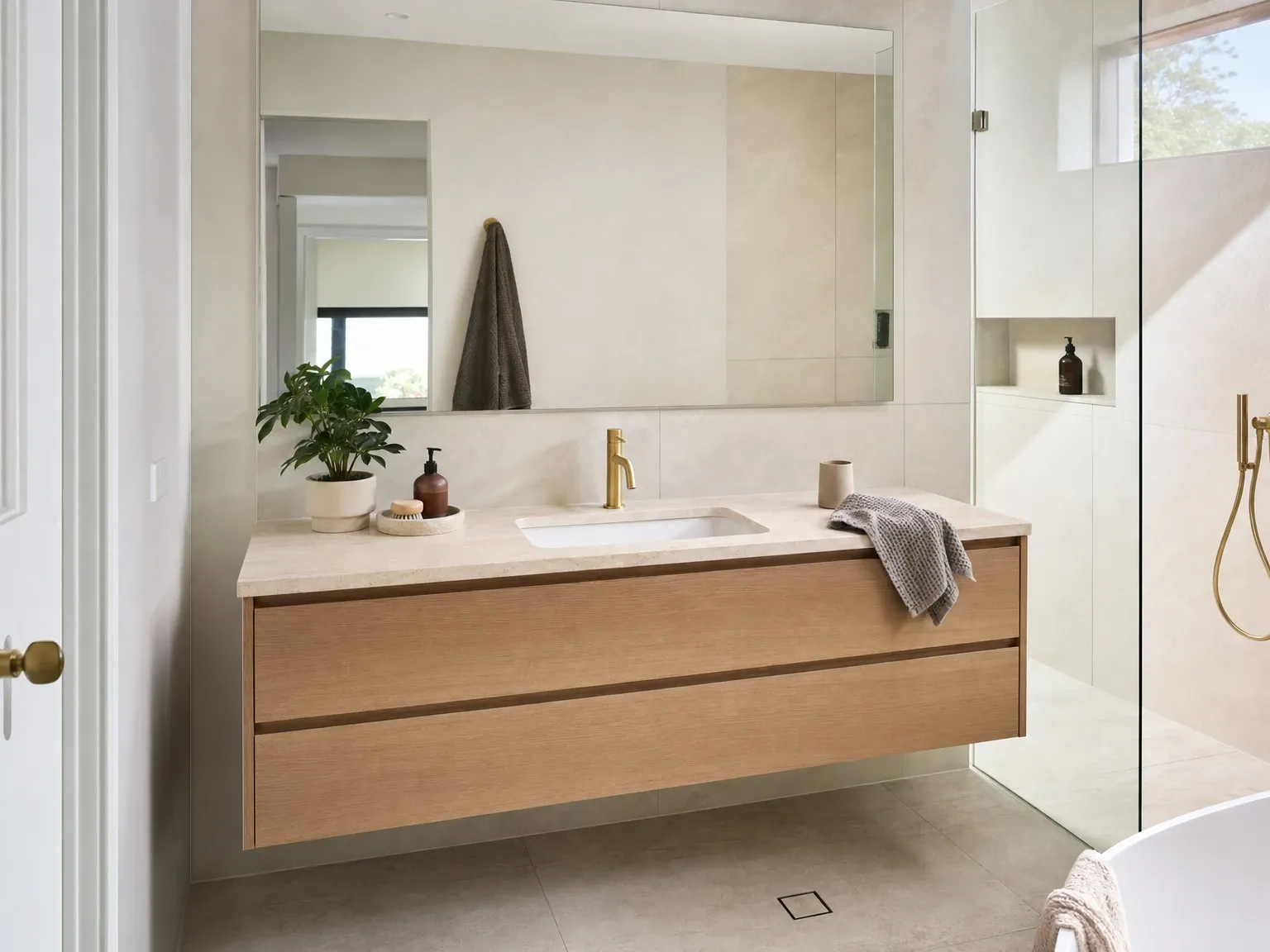 The same bathroom after a vanity upgrade with timber cabinet and porcelain top