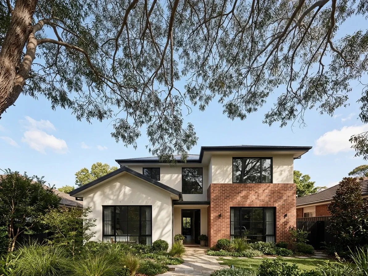 Australian home exterior with fine tree canopy against the sky
