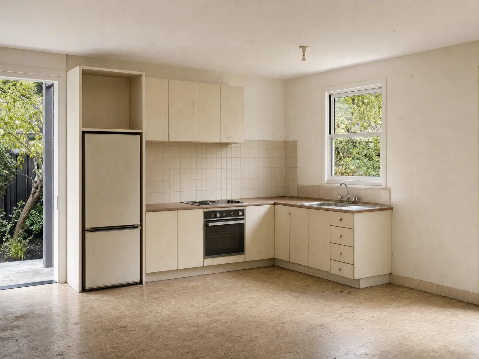 Tired pre-renovation granny flat kitchen before the kitchenette upgrade
