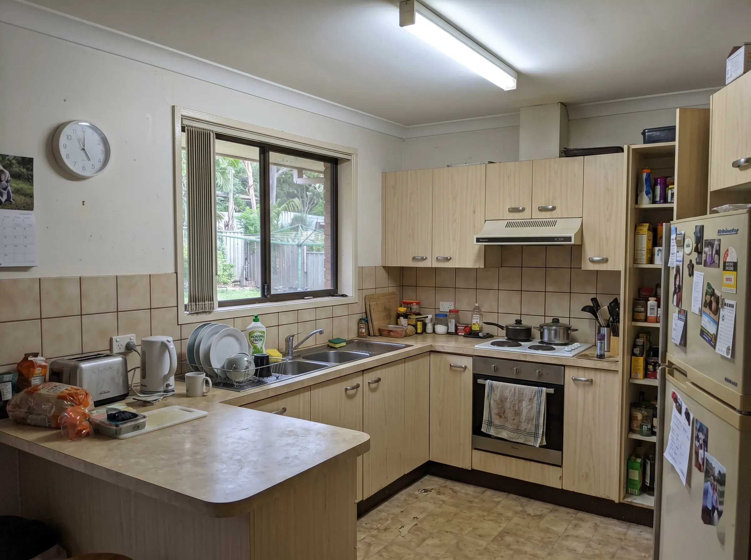 Phone photo of a tired existing Australian kitchen