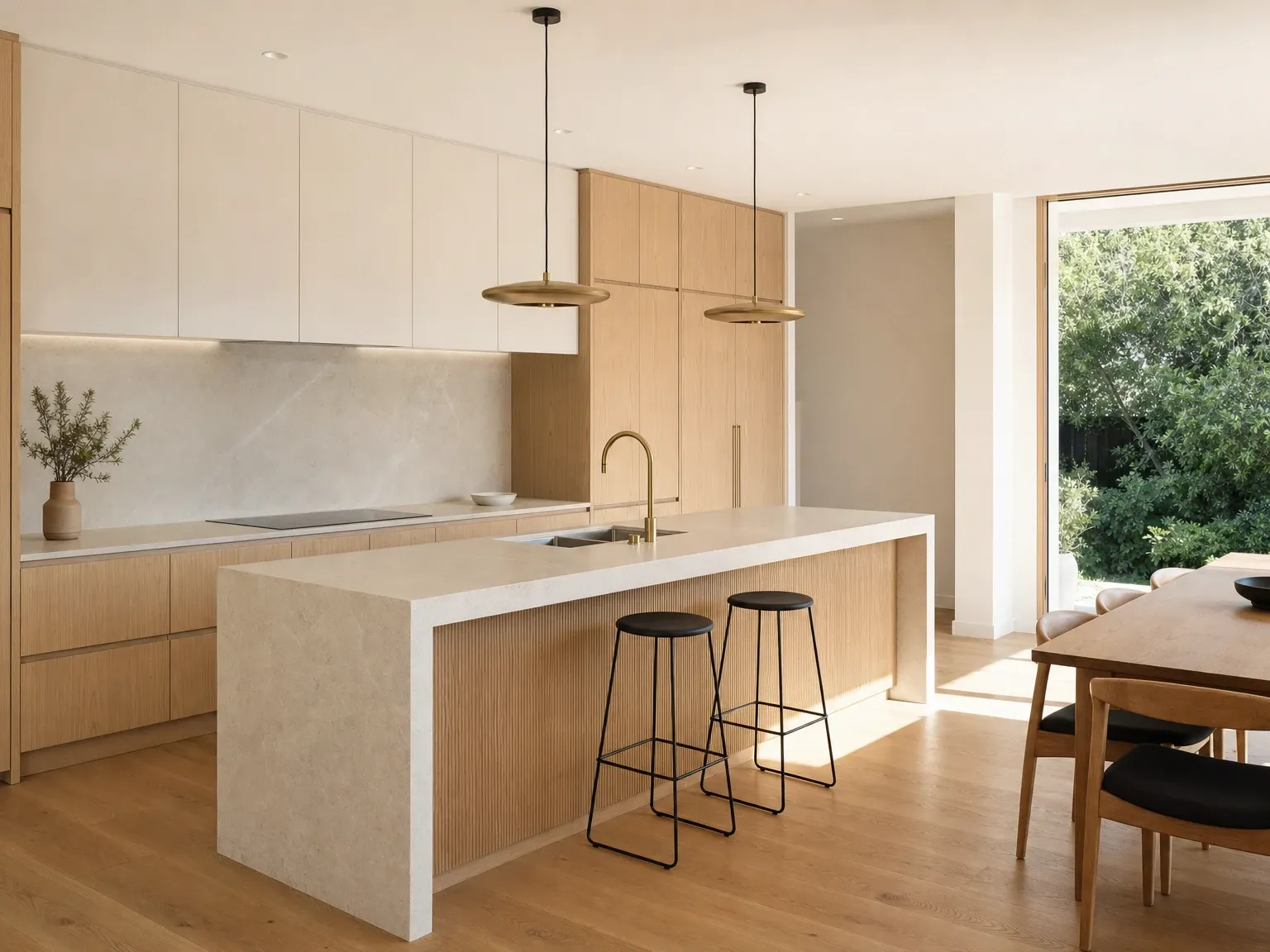 The same kitchen after a warm minimalist renovation with handleless cabinetry