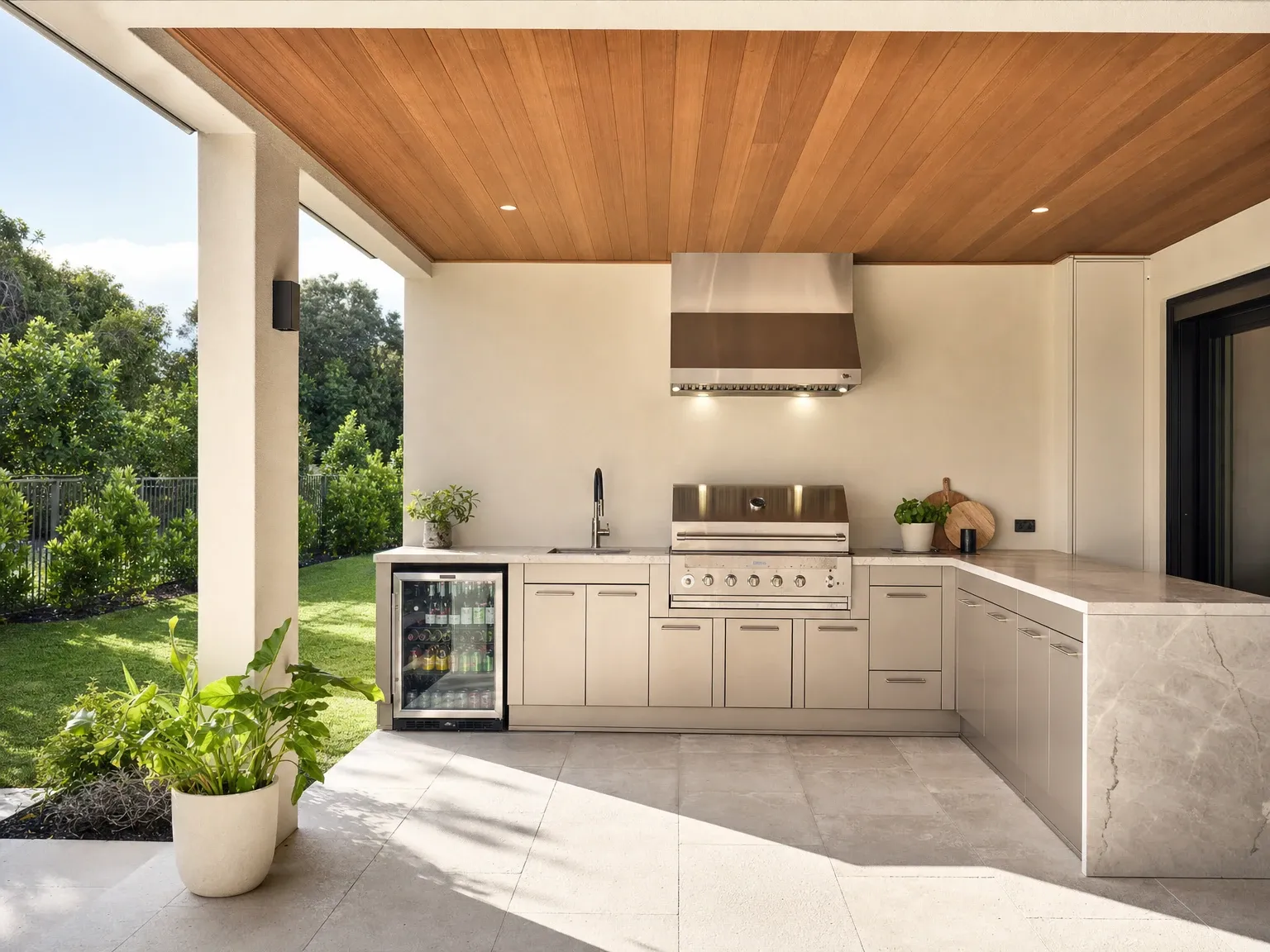 The same alfresco corner after a built-in outdoor kitchen renovation