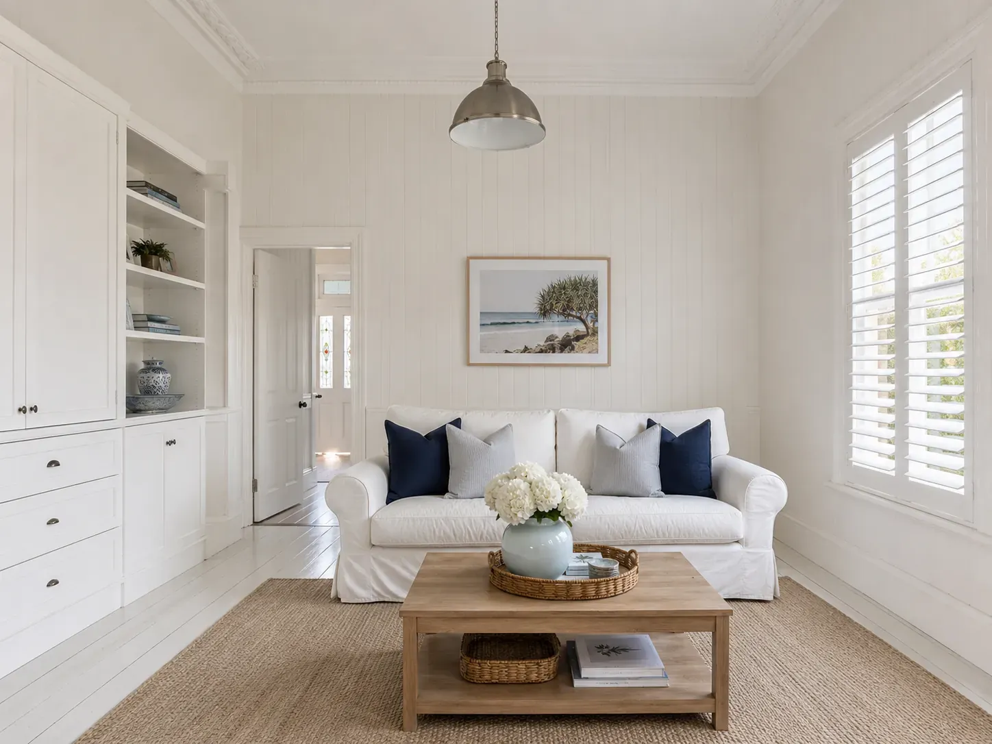 Traditional Queenslander interior styled in Australian Hamptons with VJ panelling, white shaker joinery and plantation shutters