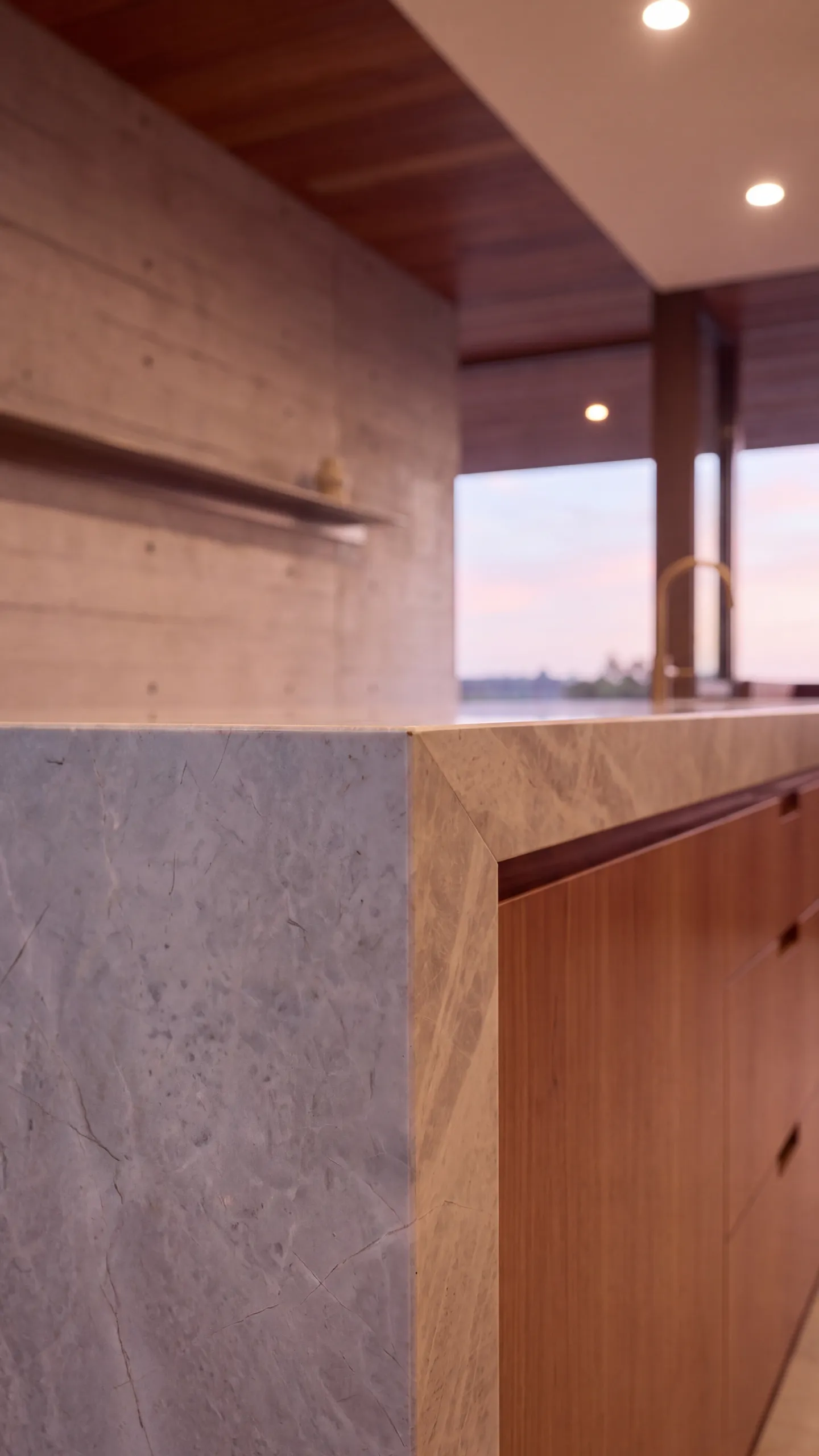 Slow close-ups of the kitchen finishes, the veined stone waterfall edge, the timber joinery with its finger pulls and the bronze gooseneck tap, then a pull back to the whole kitchen at dusk