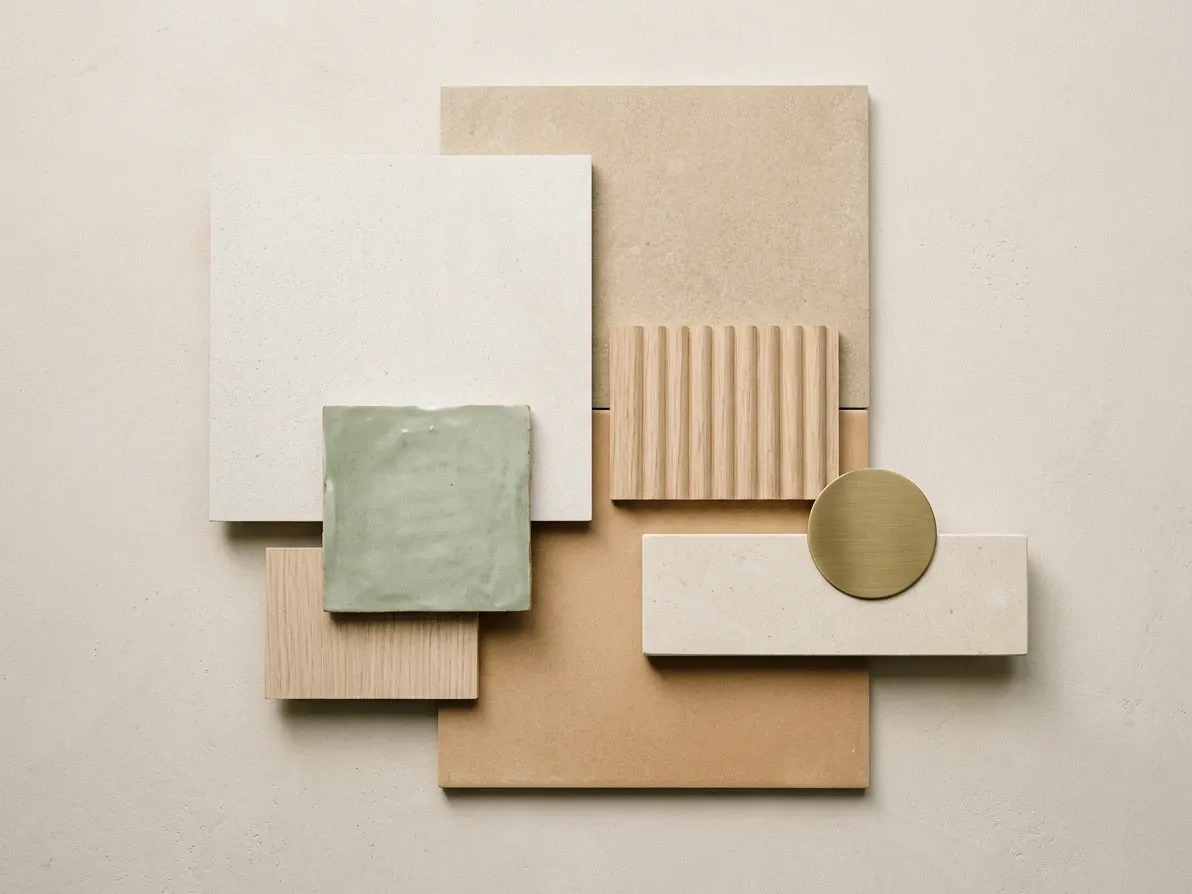 Flat lay of warm-minimalist bathroom tile samples with paired vanity, benchtop and tapware finish swatches